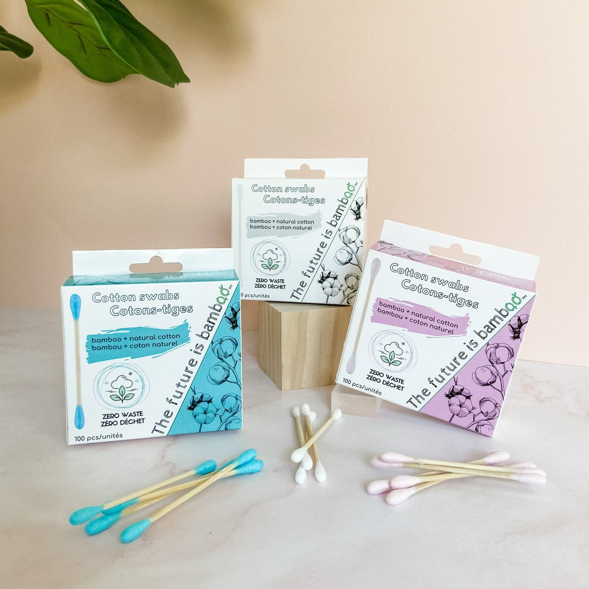 Boxes of blue, white, and pink bamboo cotton swabs
