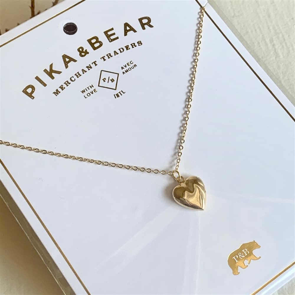 Total Eclipse of the Heart Tiny Heart Shaped Locket in Gold