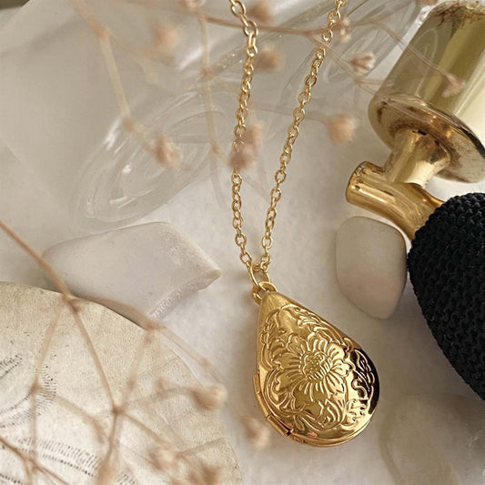 Song Sung Blue Floral Design Teardrop Locket Necklace in Gold